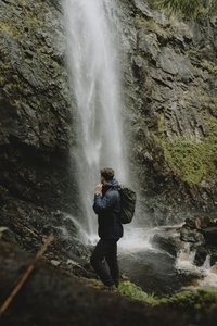 Man hiking at rocky waterfall Plodda Falls Inverness 2