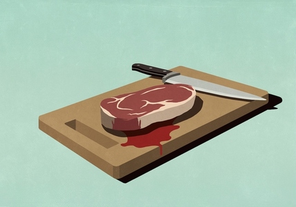 Raw bloody steak on cutting board with knife