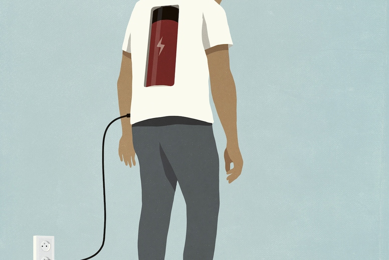 Man charging battery in back with plug