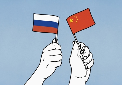 Hands waving flags of Russian and China