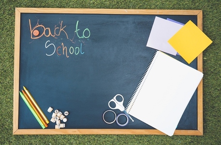 Back to school mock up with a blackboard and school materials