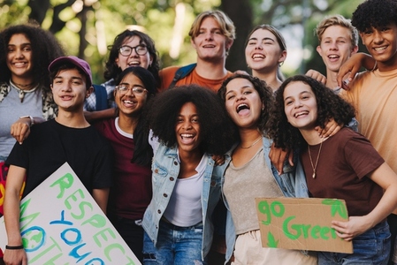 Group of multicultural teenagers holding a climate protest