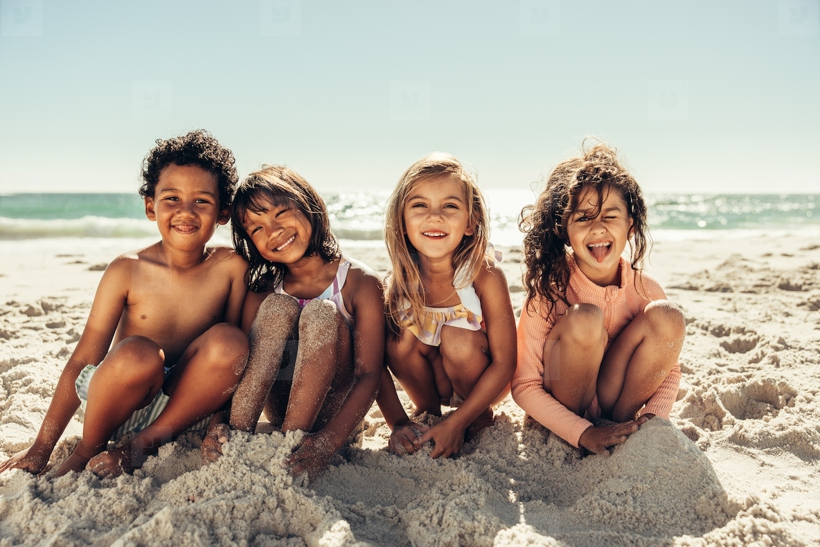 Cute kids sitting in sea sand at the beach stock photo (258751 ...