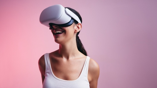 Cheerful young woman having fun in virtual reality