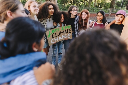 Group of multicultural young people demonstrating against climate change