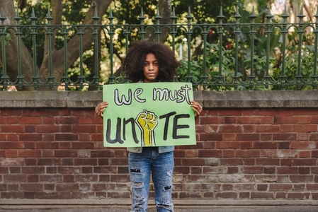 Black teenage girl campaigning for unity