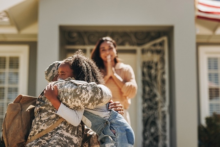 Military man saying his goodbyes to his family