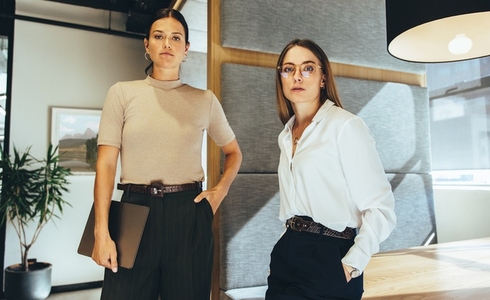 Confident businesswomen standing in an office