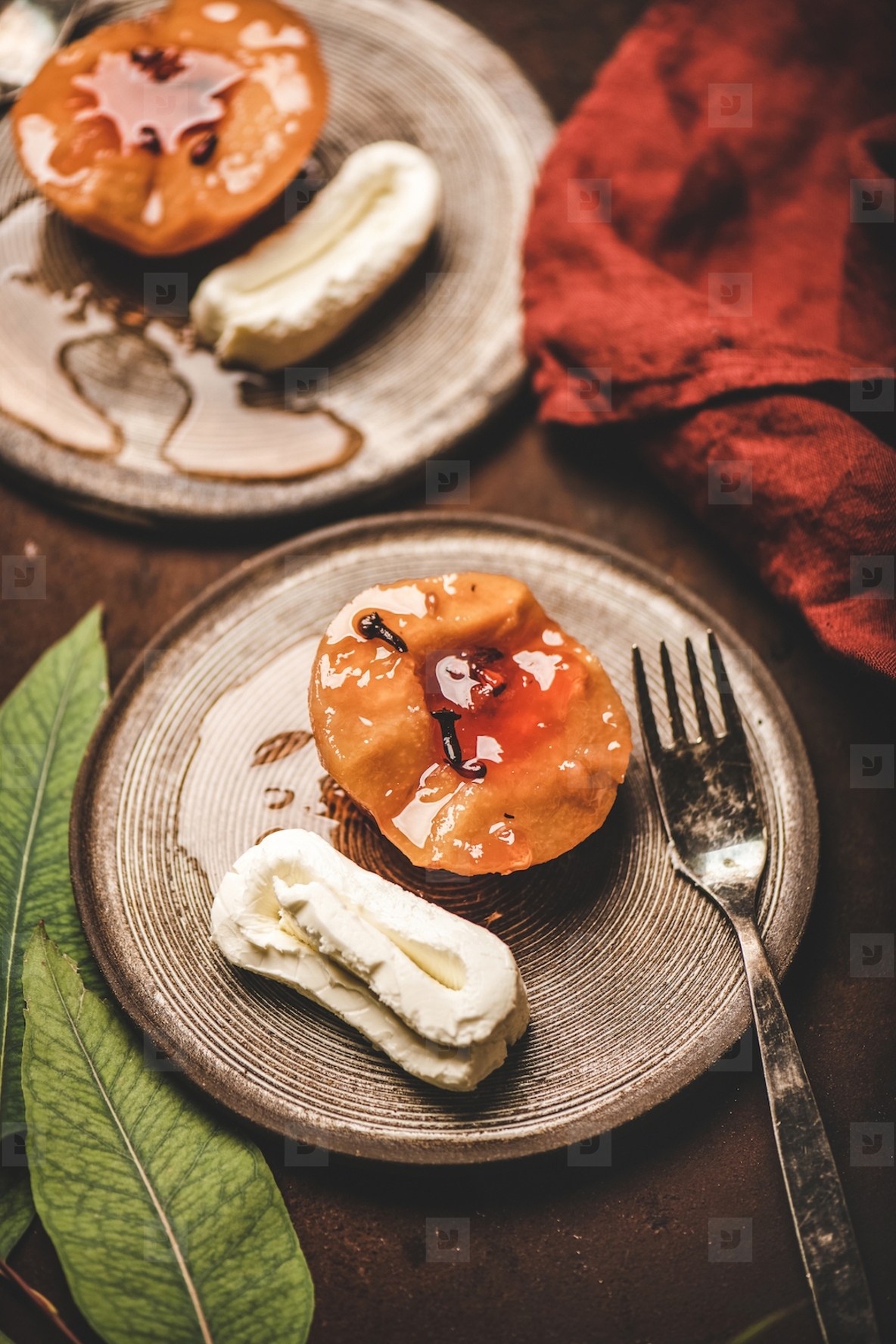 Turkish dessert with boiled quince with spices and kaymak