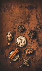 Turkish Yedi Bahar spice mix over rusty background  copy space
