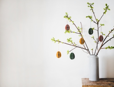 Easter holiday tree branches with festive eggs  copy space