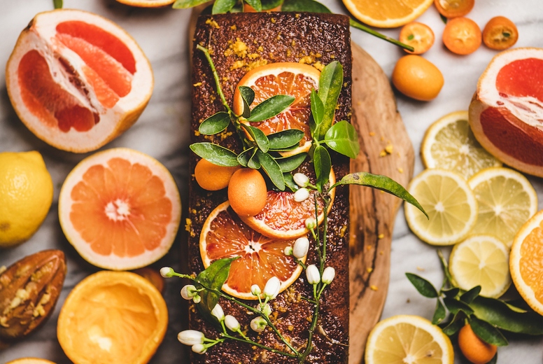 Citrus Mediterranean flourless vegan loaf cake with fresh citrus fruits