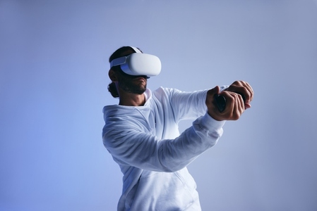 Man playing a game of cricket in virtual reality