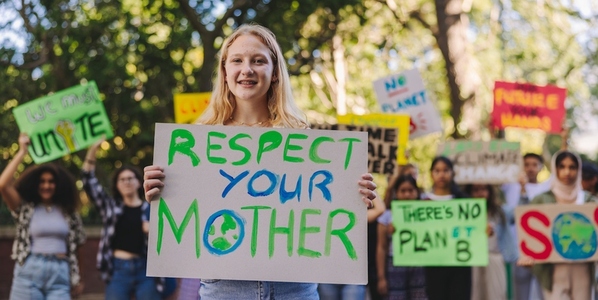 Happy youth activist leading a march against climate change
