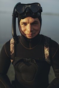 Man looking at the camera in a scuba gear