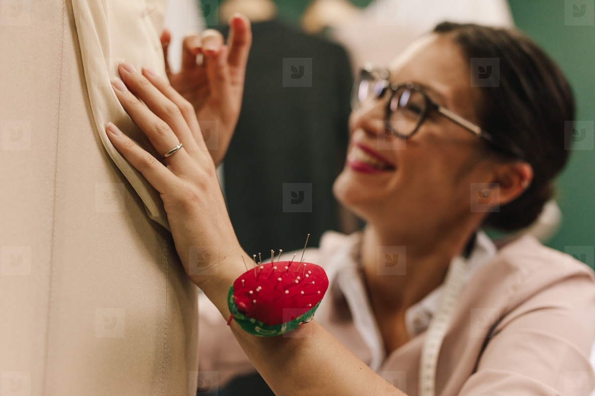 Female designer working on new dress design