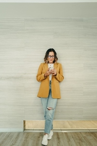 Businesswoman reading a text message on her smartphone