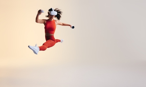 Athletic young woman running in virtual reality