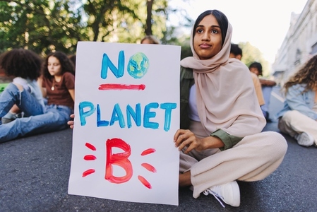 Muslim girl protesting against climate change and global warming