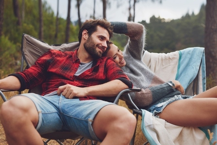 Loving young couple camping in nature