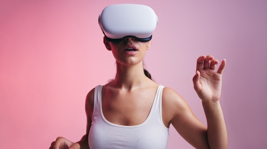Woman entering a virtual reality game in a studio