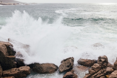 Big waves crashing on the rocks on the coast