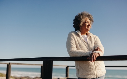 Senior woman enjoying a refreshing view at the beach