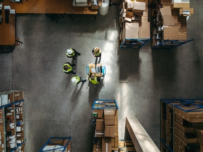 Aerial view of warehouse workers having a meeting