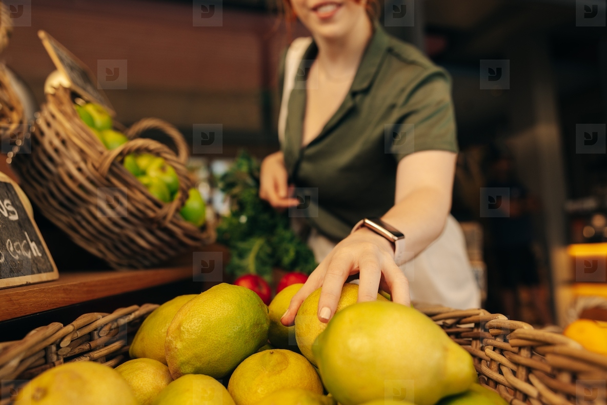 Happy customer buying fruits and vegetables in a grocery store