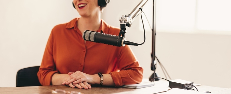 Happy woman appearing as a guest on a radio show