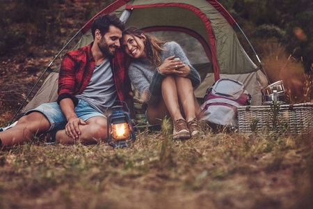 Romantic couple on a camping holiday