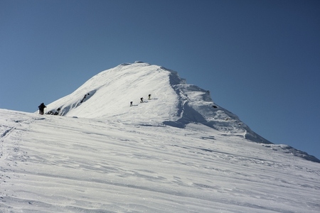 Mountain climbers climbing sunny