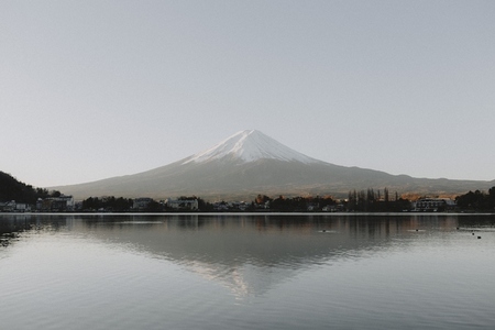 Scenic sunrise view Mount Fuji over tranquil