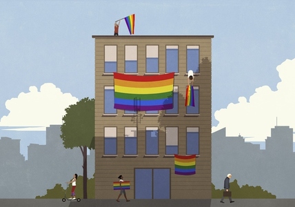Rainbow pride flags hanging from urban building