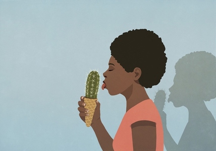 Woman eating cactus ice cream cone