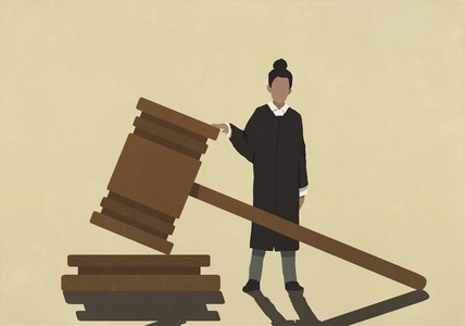 Female judge standing at large gavel