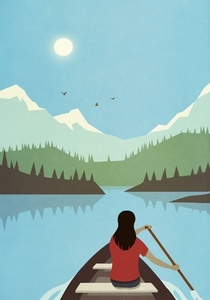Woman canoeing on tranquil idyllic summer mountain lake