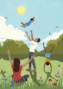 Happy family playing in sunny idyllic summer meadow
