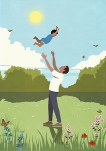 Father throwing playful son overhead in sunny