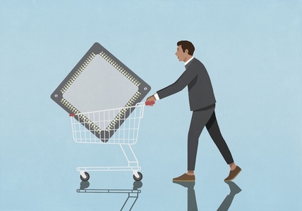 Businessman pushing shopping cart with semiconductor