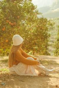 Lady in the orange orchard