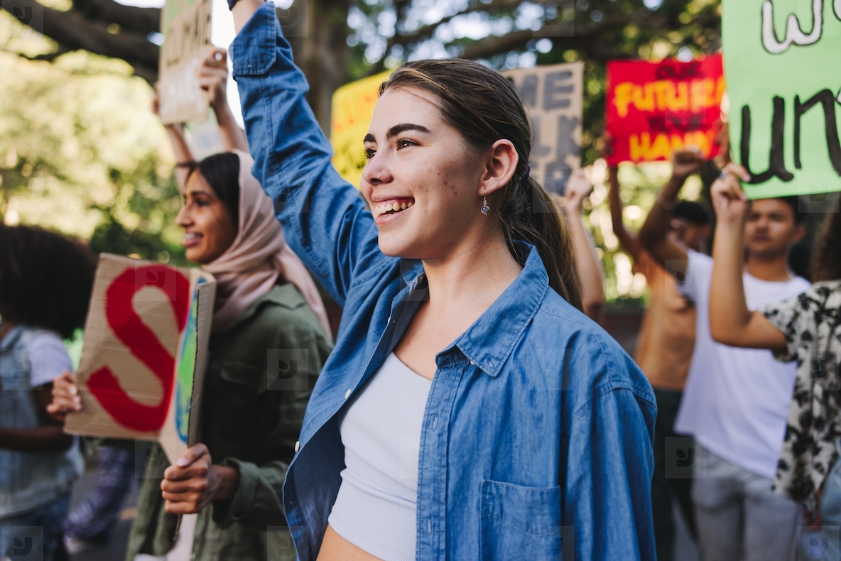 Happy young people standing up against climate change