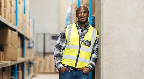 Portrait of a warehouse picker smiling at the camera