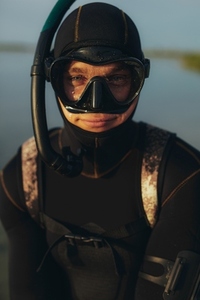 Young man wearing a snorkeling gear