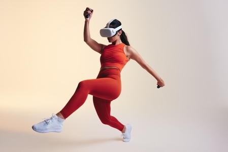 Woman doing workout moves in virtual reality