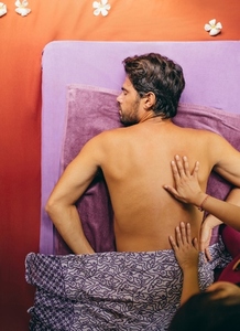Man receiving massage at day spa