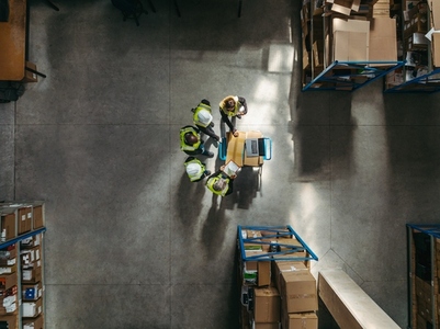 Aerial view of a warehouse team having a staff meeting