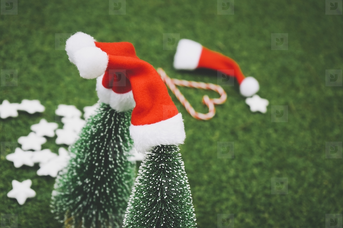 Classic christmas background with christmas tree, santas hat and