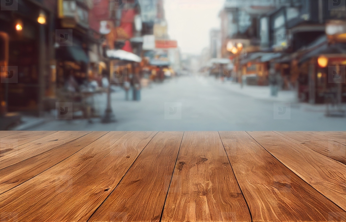 Empty wood table top on blur abstract of street restaurant outdo