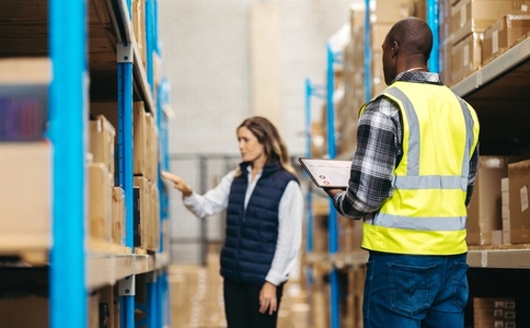 Warehouse staff using warehouse management software